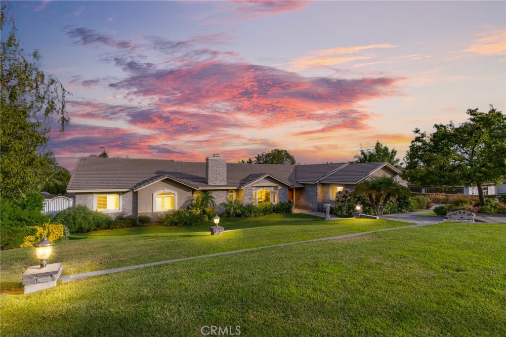 8099 Inspiration Drive Rancho Cucamonga, CA 91701 - Photo 1 of 1 a front view of house with yard and green space