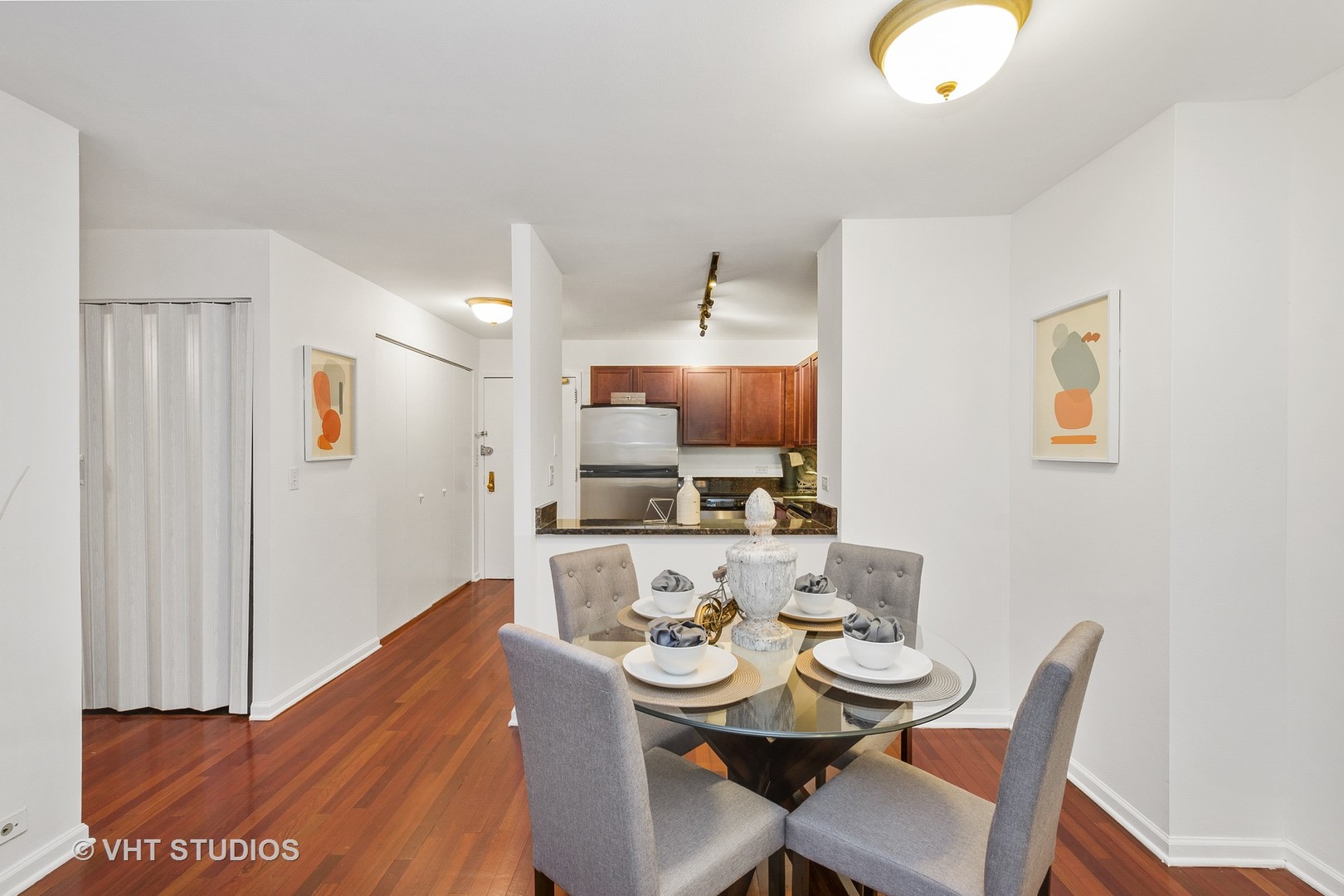 222 East Pearson Street, Unit 707 Chicago, IL 60611 - Photo 11 of 13 a view of a dining room with furniture