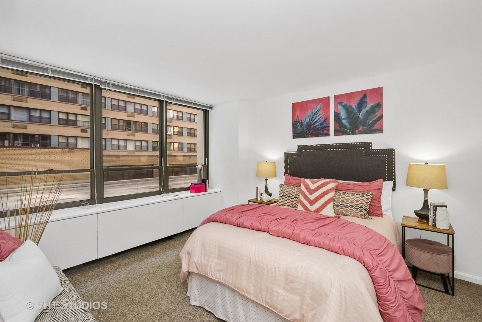 222 East Pearson Street, Unit 707 Chicago, IL 60611 - Photo 12 of 13 a bedroom with a bed and a large window