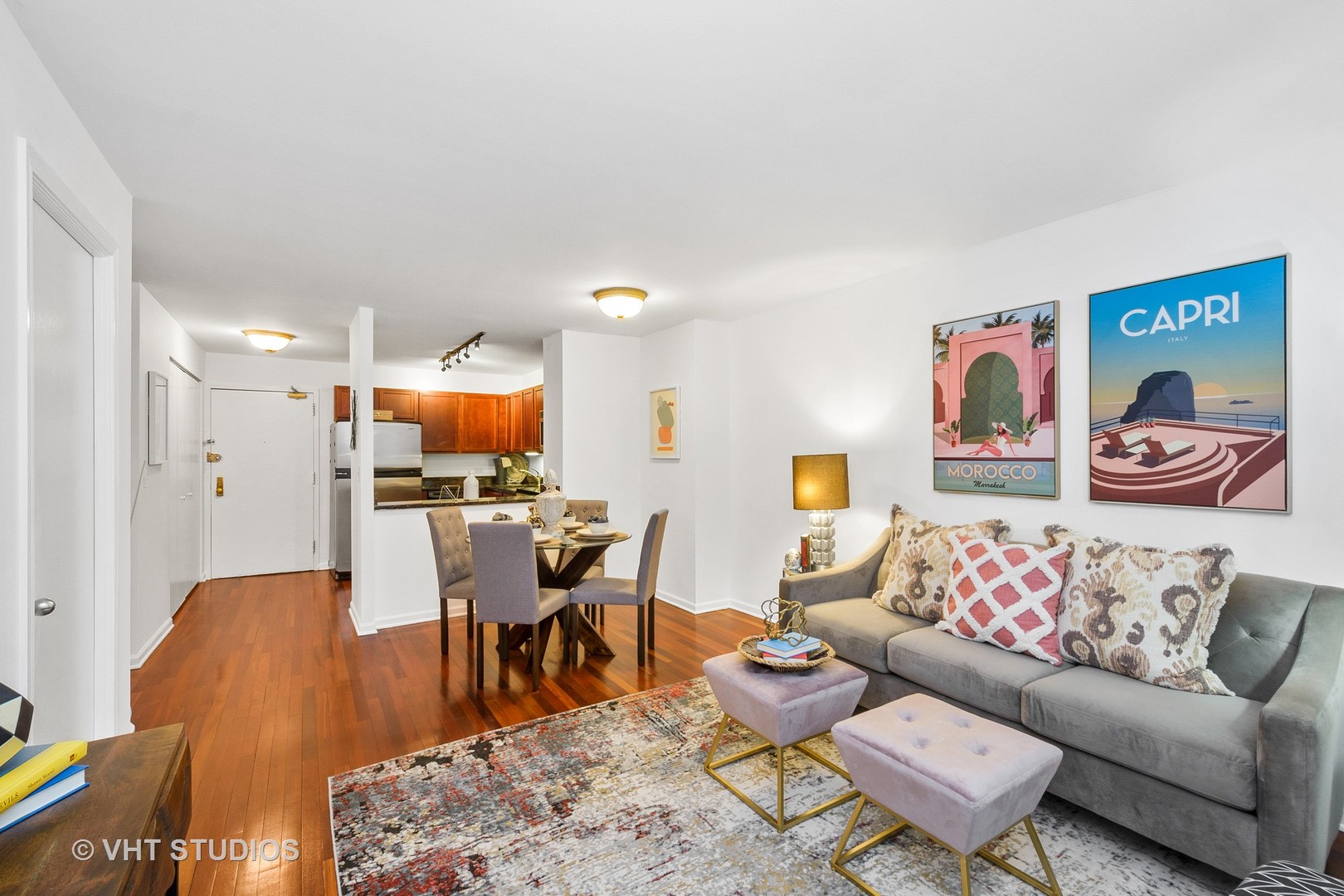 222 East Pearson Street, Unit 707 Chicago, IL 60611 - Photo 2 of 13 a living room with furniture and a wooden floor