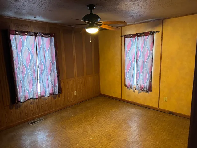a view of a room with a window and a bath tub