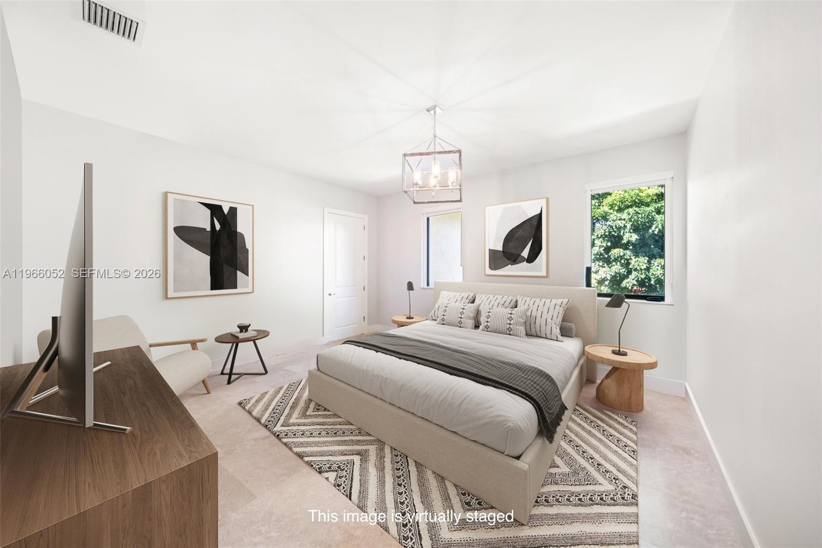 6001 Southwest 28th Street Miami, FL 33155 - Photo 18 of 30 a bedroom with a bed and a flat screen tv