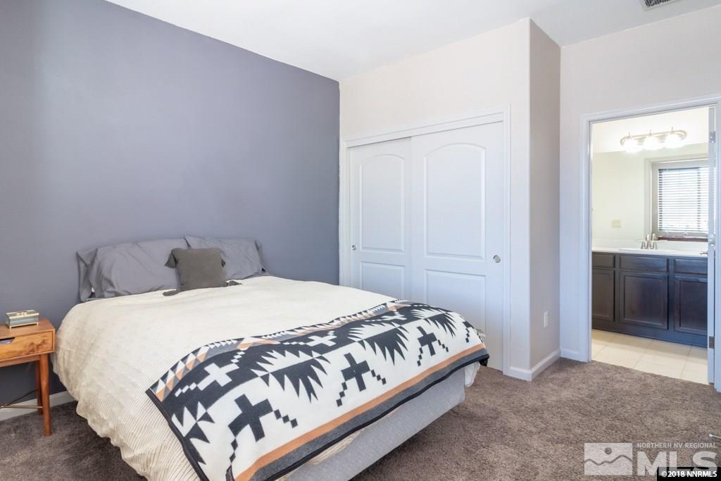 9635 Caitlin Court Reno, NV 89521 - Photo 14 of 23 a bedroom with a bed and a cabinets