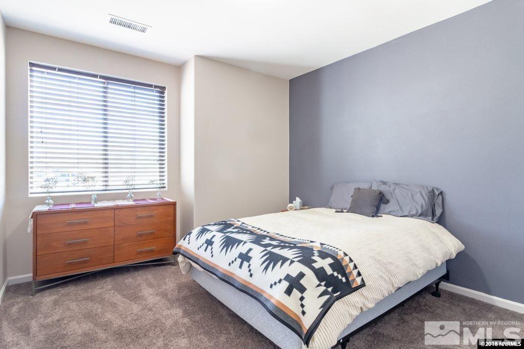 9635 Caitlin Court Reno, NV 89521 - Photo 15 of 23 a bedroom with a bed and window