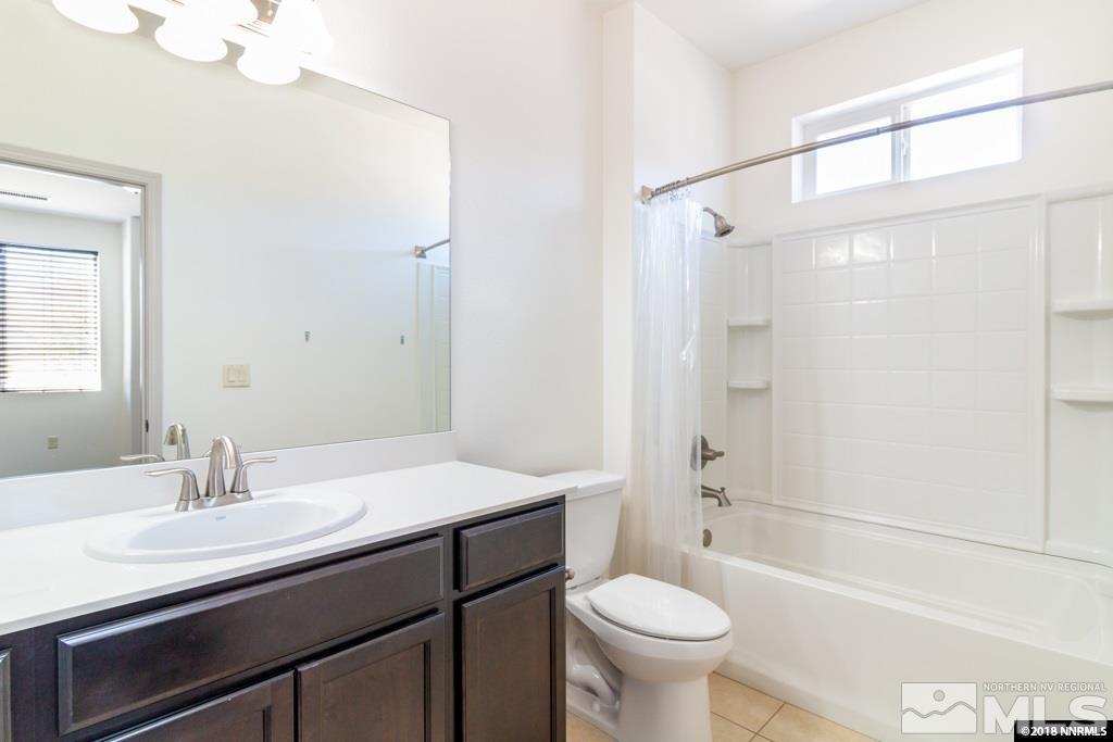 9635 Caitlin Court Reno, NV 89521 - Photo 16 of 23 a bathroom with a sink and a mirror
