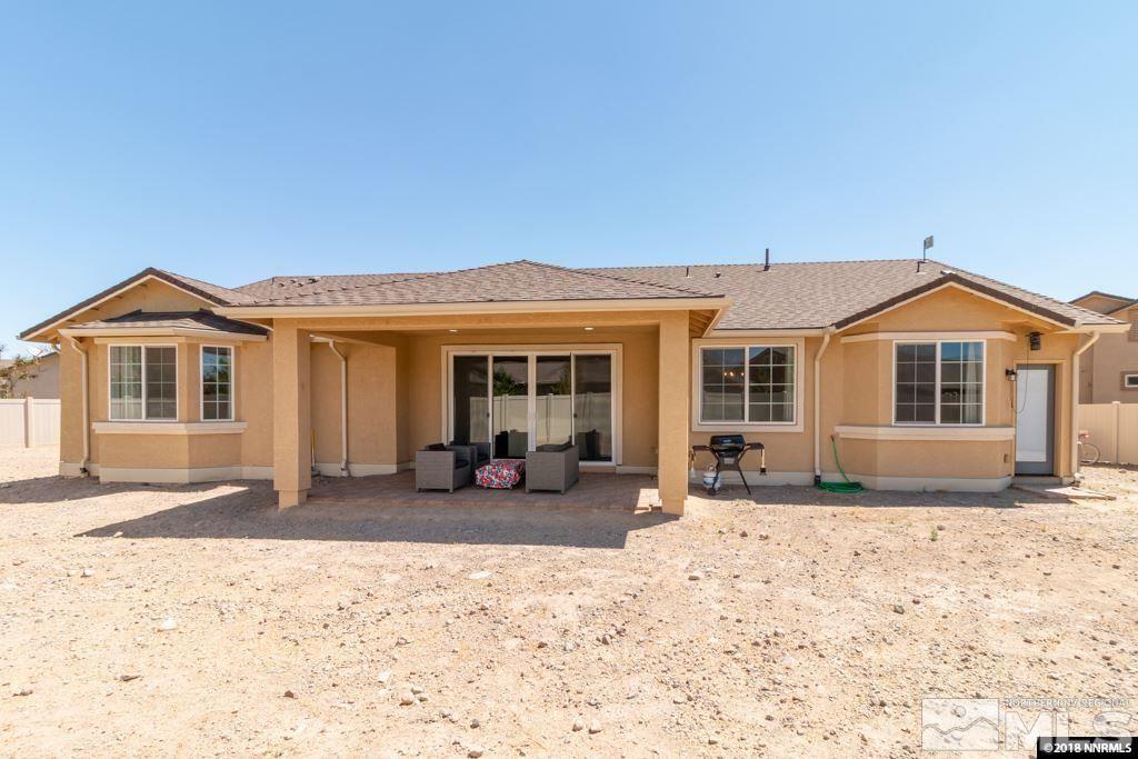 9635 Caitlin Court Reno, NV 89521 - Photo 22 of 23 a front view of a house with a outdoor space