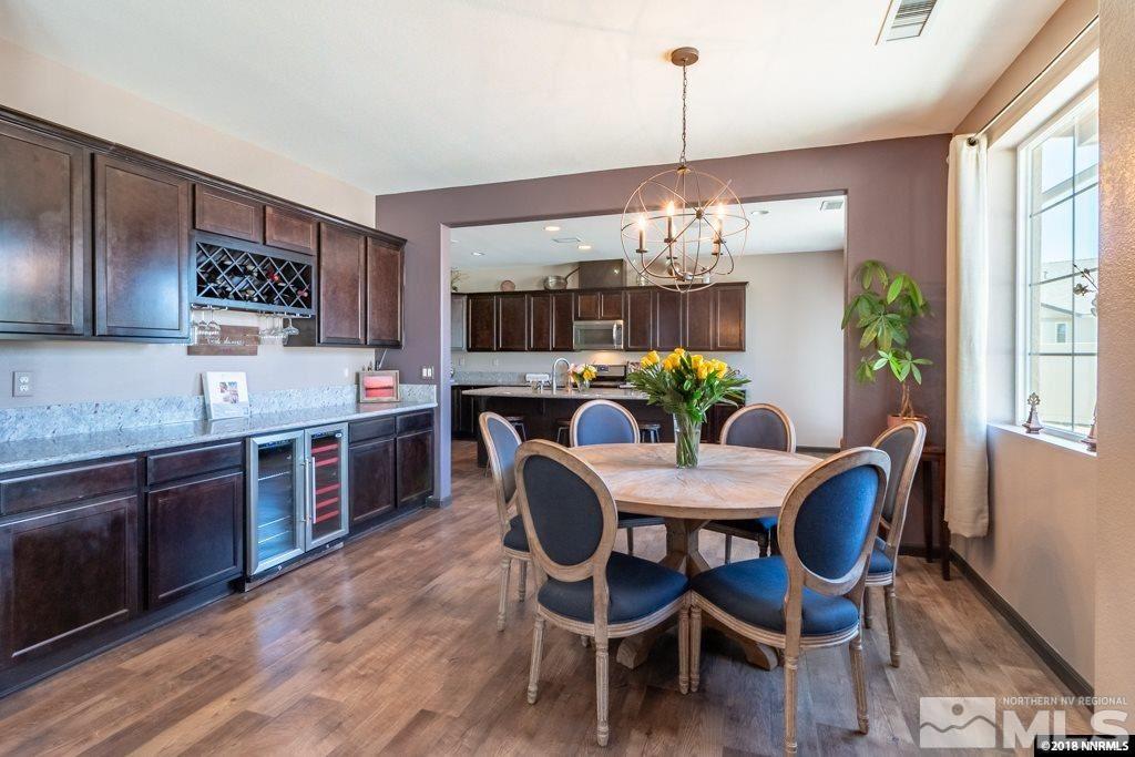 9635 Caitlin Court Reno, NV 89521 - Photo 5 of 23 a dining room with furniture a chandelier and wooden floor