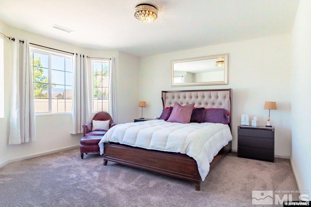9635 Caitlin Court Reno, NV 89521 - Photo 10 of 23 a bedroom with a bed and a window