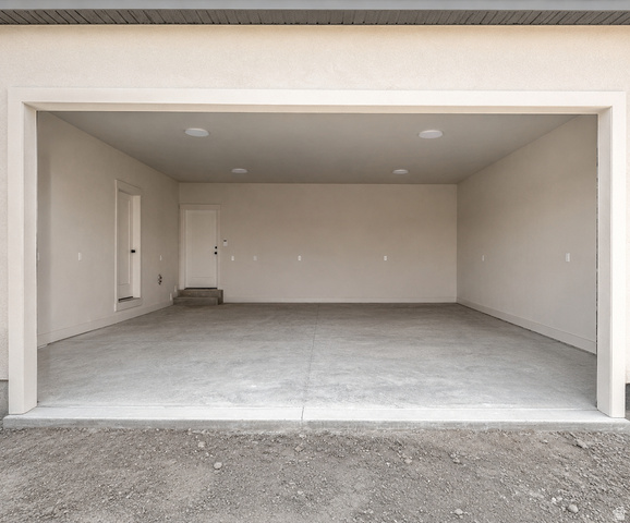 840 South Jones Road Monroe, UT 84754 - Photo 4 of 6 Spacious garage with a concrete floor, recessed lighting, and direct access doors