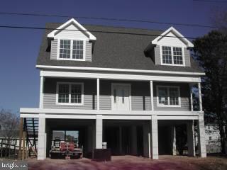 15 West Torquay Road Ocean City, MD 21842 - Photo 1 of 6 a front view of a building with many windows
