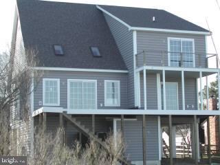 15 West Torquay Road Ocean City, MD 21842 - Photo 2 of 6 a front view of a house with balcony