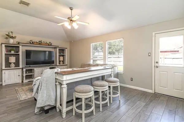a view of a dining room with furniture window and wooden floor