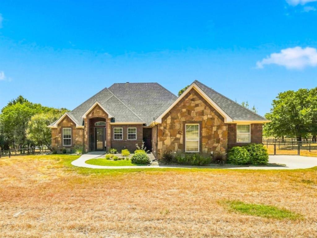 149 Overton Ridge Circle Weatherford, TX 76088 - Photo 1 of 39 Stone and brick exterior with a gray shingle roof