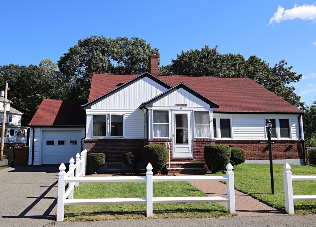 34 Adams Avenue Saugus, MA 01906 - Photo 1 of 42 a front view of a house with a yard