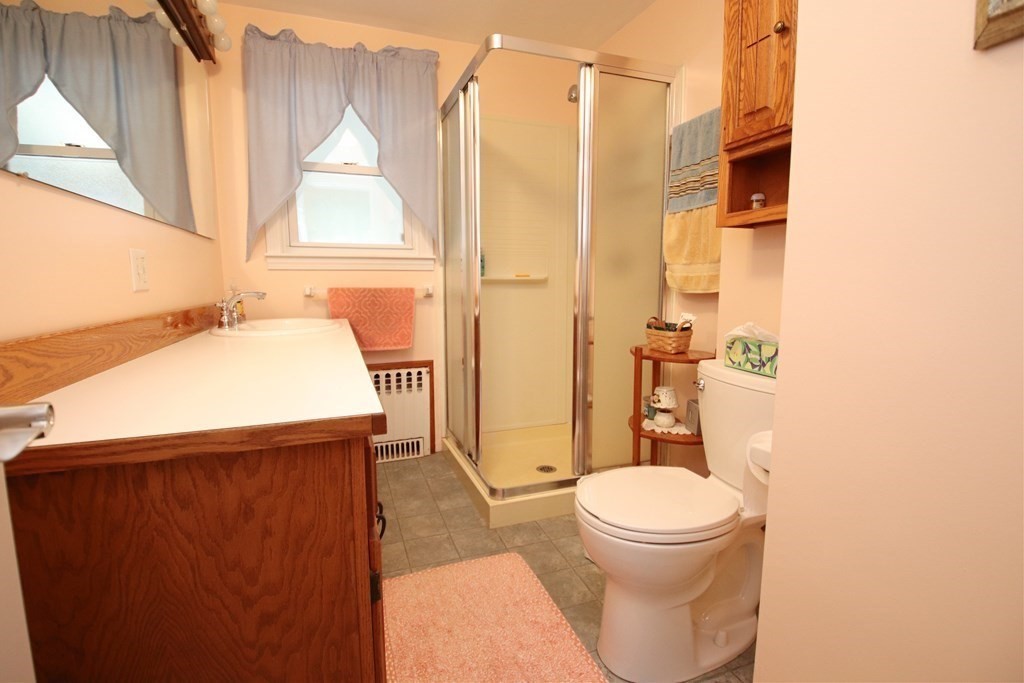 34 Adams Avenue Saugus, MA 01906 - Photo 15 of 42 a bathroom with a sink a toilet and shower