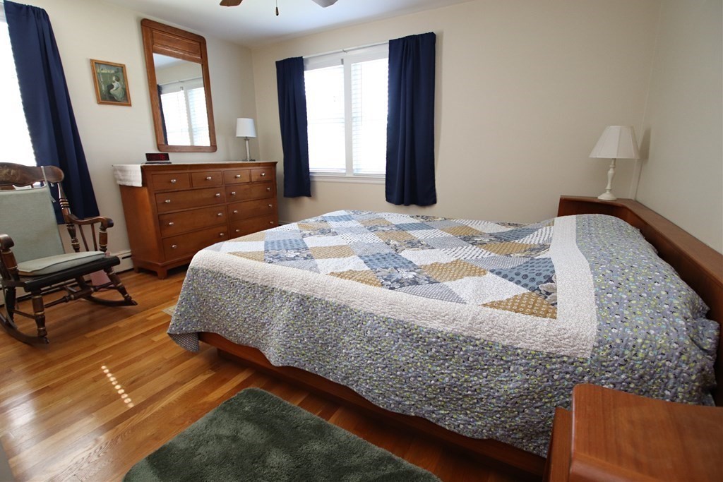 34 Adams Avenue Saugus, MA 01906 - Photo 16 of 42 a bed sitting in a bedroom next to a window