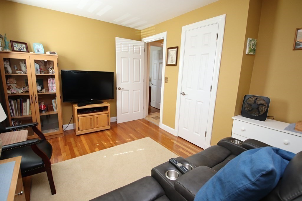 34 Adams Avenue Saugus, MA 01906 - Photo 18 of 42 a living room with furniture and a flat screen tv
