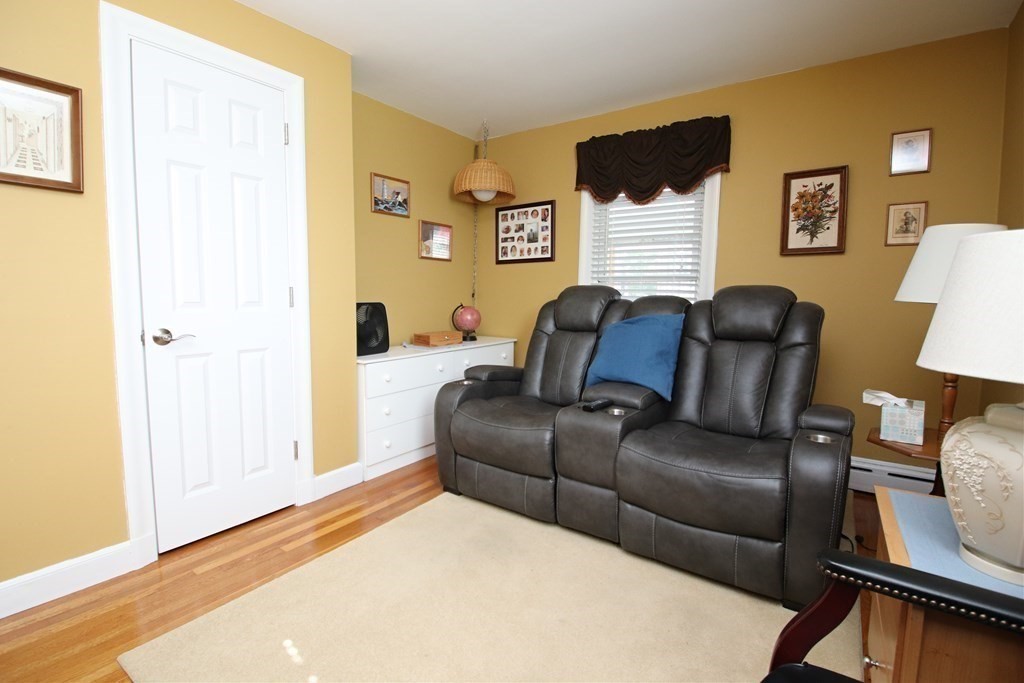 34 Adams Avenue Saugus, MA 01906 - Photo 19 of 42 a living room with furniture and a window