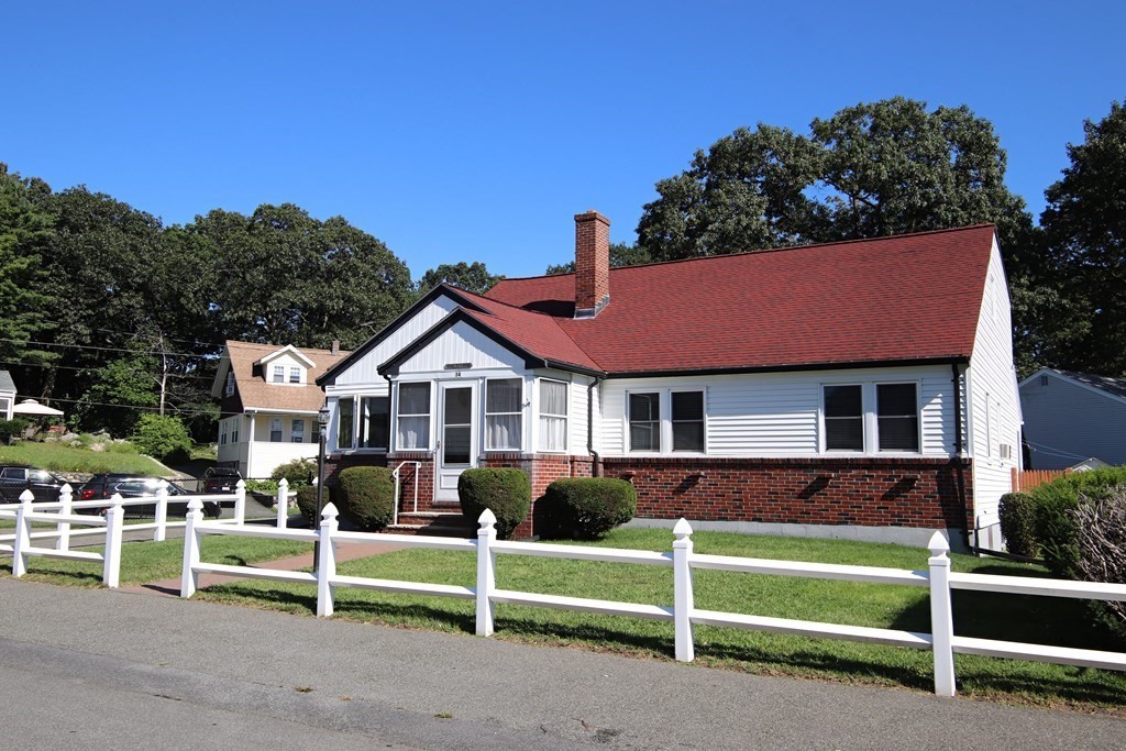 34 Adams Avenue Saugus, MA 01906 - Photo 2 of 42 a view of a house with wooden fence and a yard