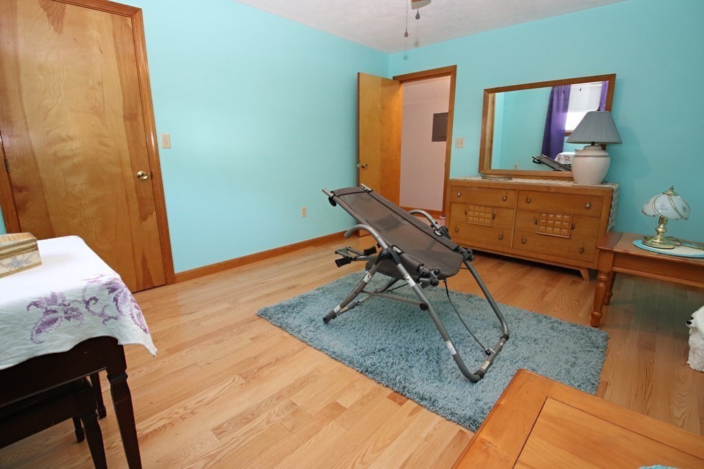 34 Adams Avenue Saugus, MA 01906 - Photo 26 of 42 a bedroom with a bed and wooden floor