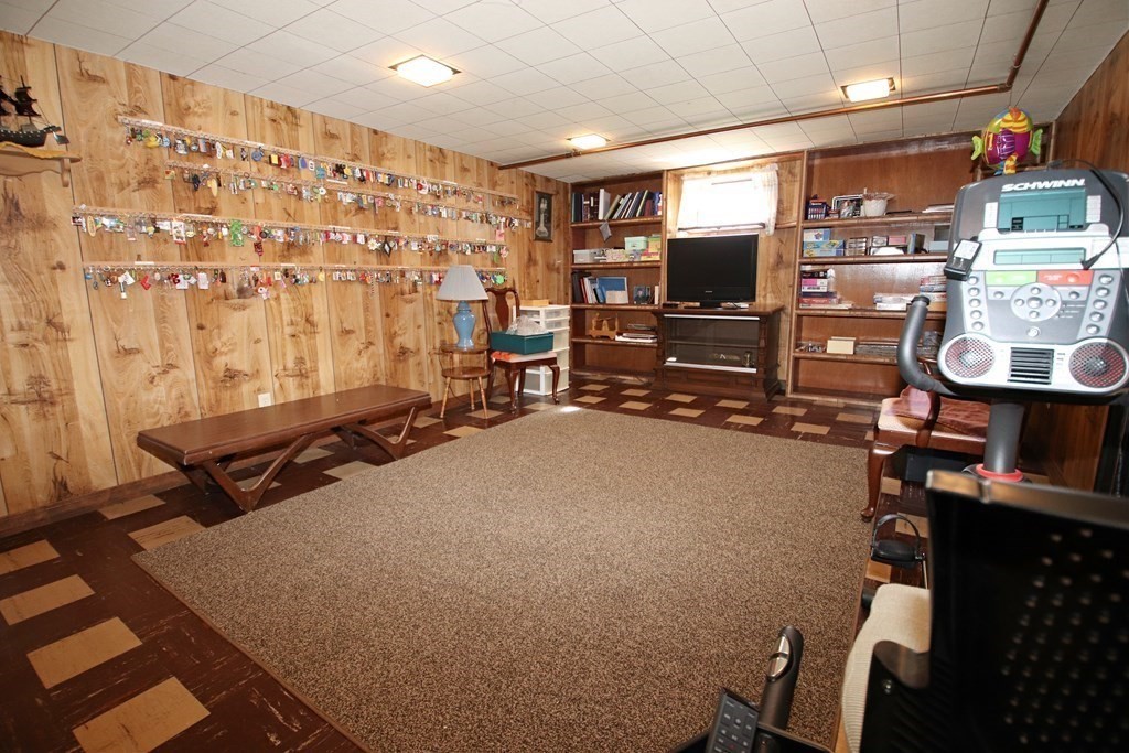 34 Adams Avenue Saugus, MA 01906 - Photo 29 of 42 a room with furniture and a flat screen tv