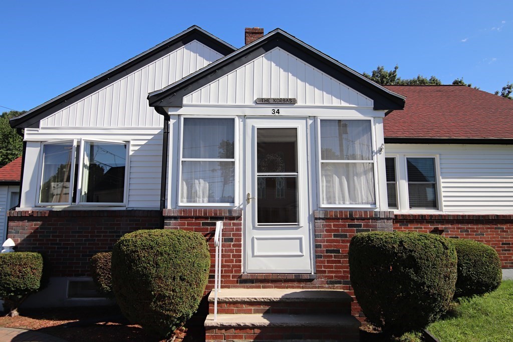 34 Adams Avenue Saugus, MA 01906 - Photo 3 of 42 a front view of a house with a yard