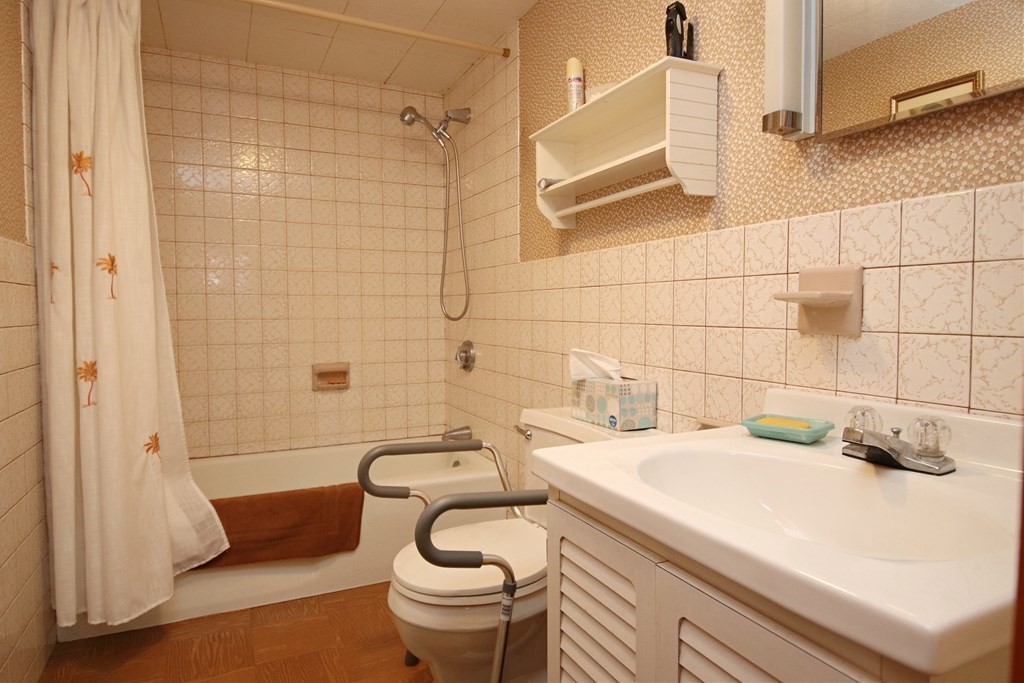 34 Adams Avenue Saugus, MA 01906 - Photo 32 of 42 a bathroom with a sink and a bathtub