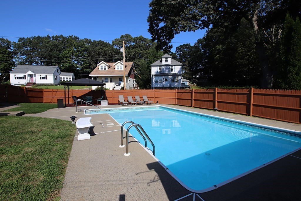 34 Adams Avenue Saugus, MA 01906 - Photo 37 of 42 a view of a tennis ground with large trees