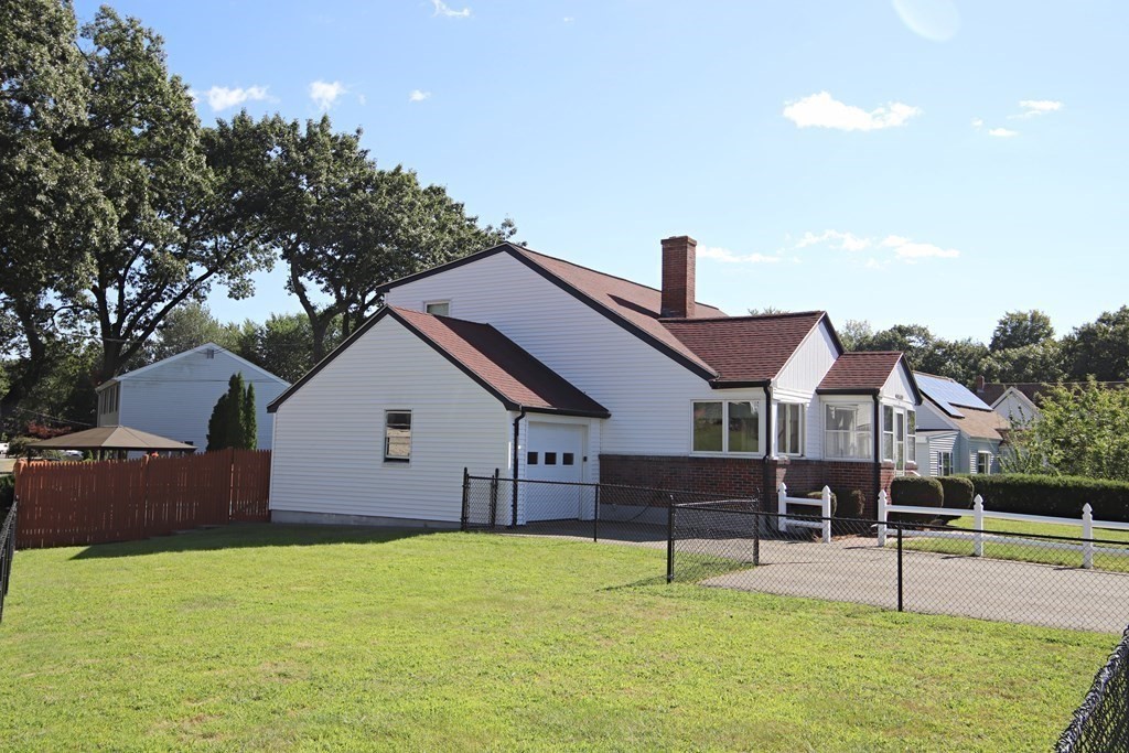 34 Adams Avenue Saugus, MA 01906 - Photo 41 of 42 a front view of a house with a yard