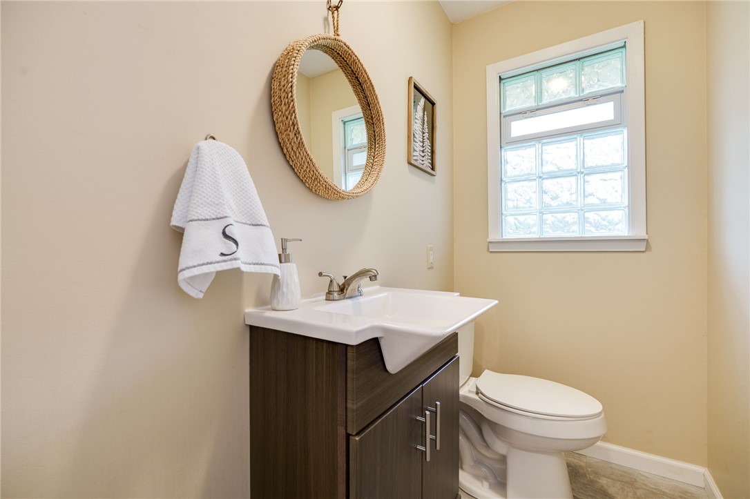 6950 Red Lion 5 Points Road Springboro, OH 45066 - Photo 27 of 78 This bright bathroom features a vanity with ample storage and a window providing natural light.