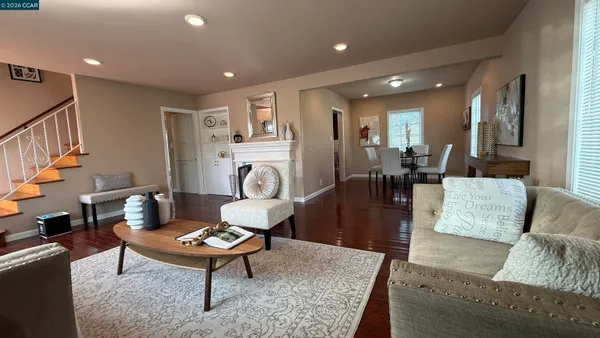 a kitchen with stainless steel appliances granite countertop wooden cabinets a stove top oven and granite counter tops