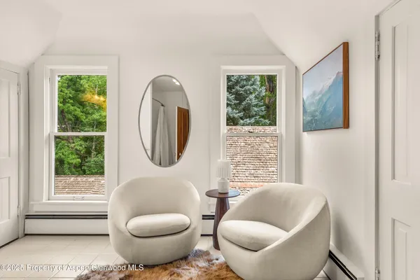a living room with furniture and a rug