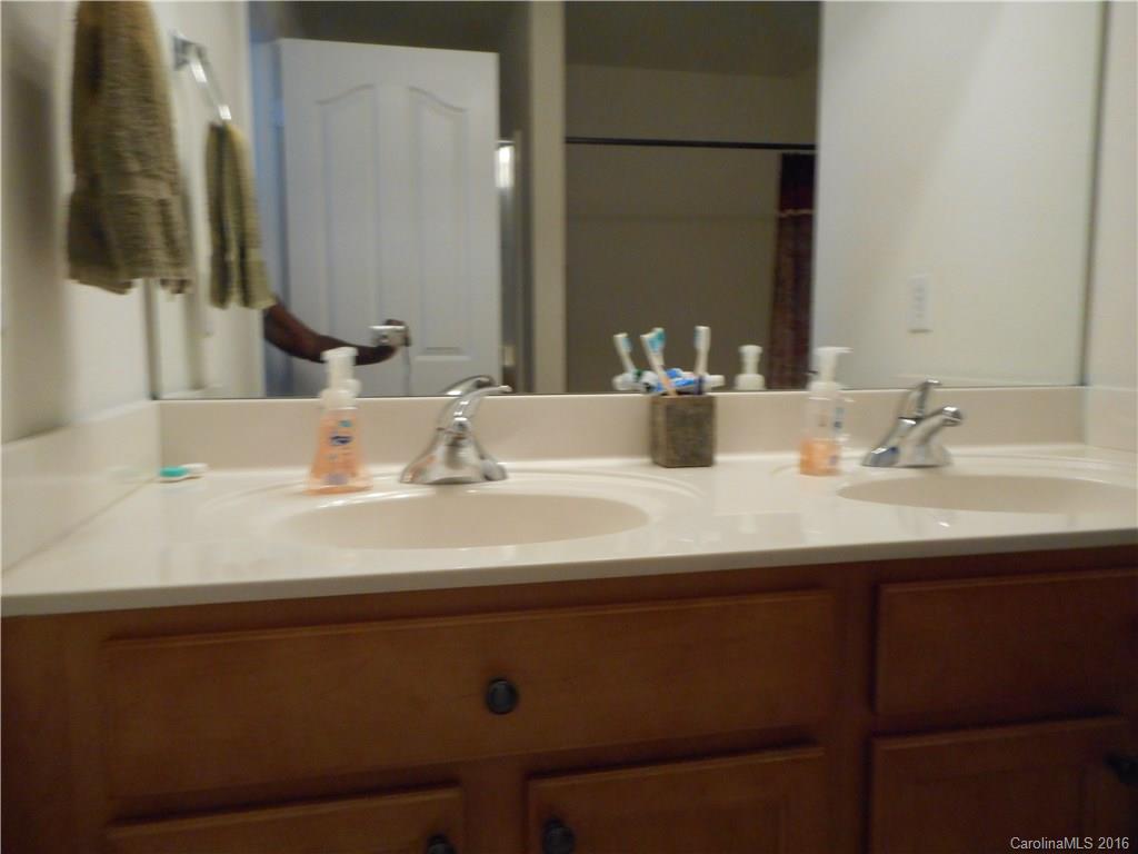2987 Arthur Road, Unit 173 Indian Land, SC 29707 - Photo 12 of 18 a bathroom with a sink and a mirror