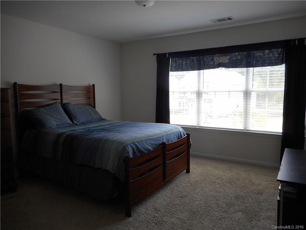 2987 Arthur Road, Unit 173 Indian Land, SC 29707 - Photo 15 of 18 a bedroom with a bed and a window