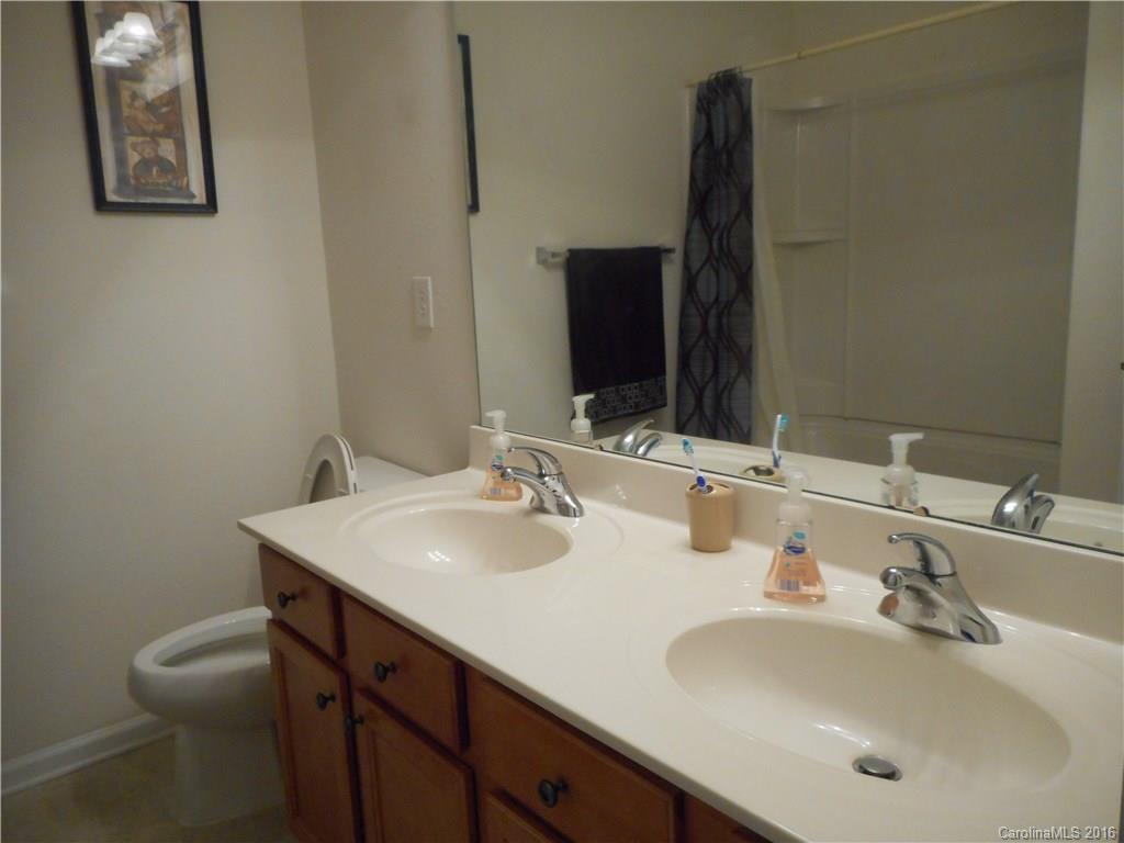 2987 Arthur Road, Unit 173 Indian Land, SC 29707 - Photo 17 of 18 a bathroom with a sink and a mirror