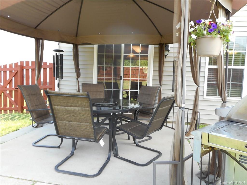 2987 Arthur Road, Unit 173 Indian Land, SC 29707 - Photo 3 of 18 a view of a dining room with furniture window and outside view