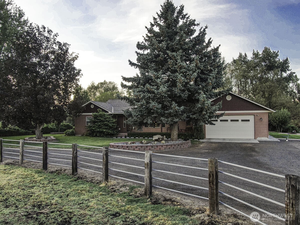 211 Last Chance Road Walla Walla, WA 99362 - Photo 1 of 40 a view of a house with a small yard and wooden fence