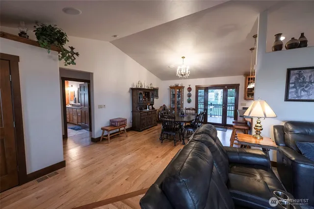 a view of a livingroom with furniture and a flat screen tv