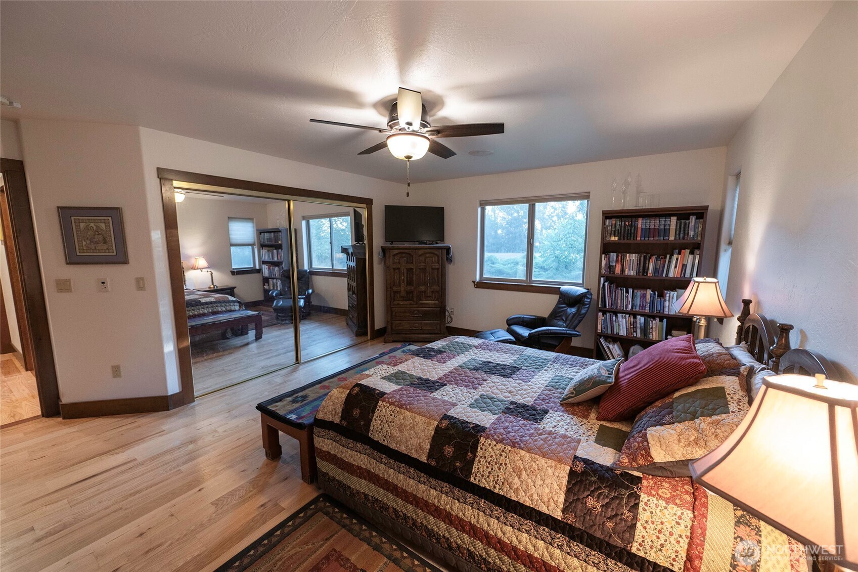 211 Last Chance Road Walla Walla, WA 99362 - Photo 29 of 40 a bed room with a bed and a bookshelf