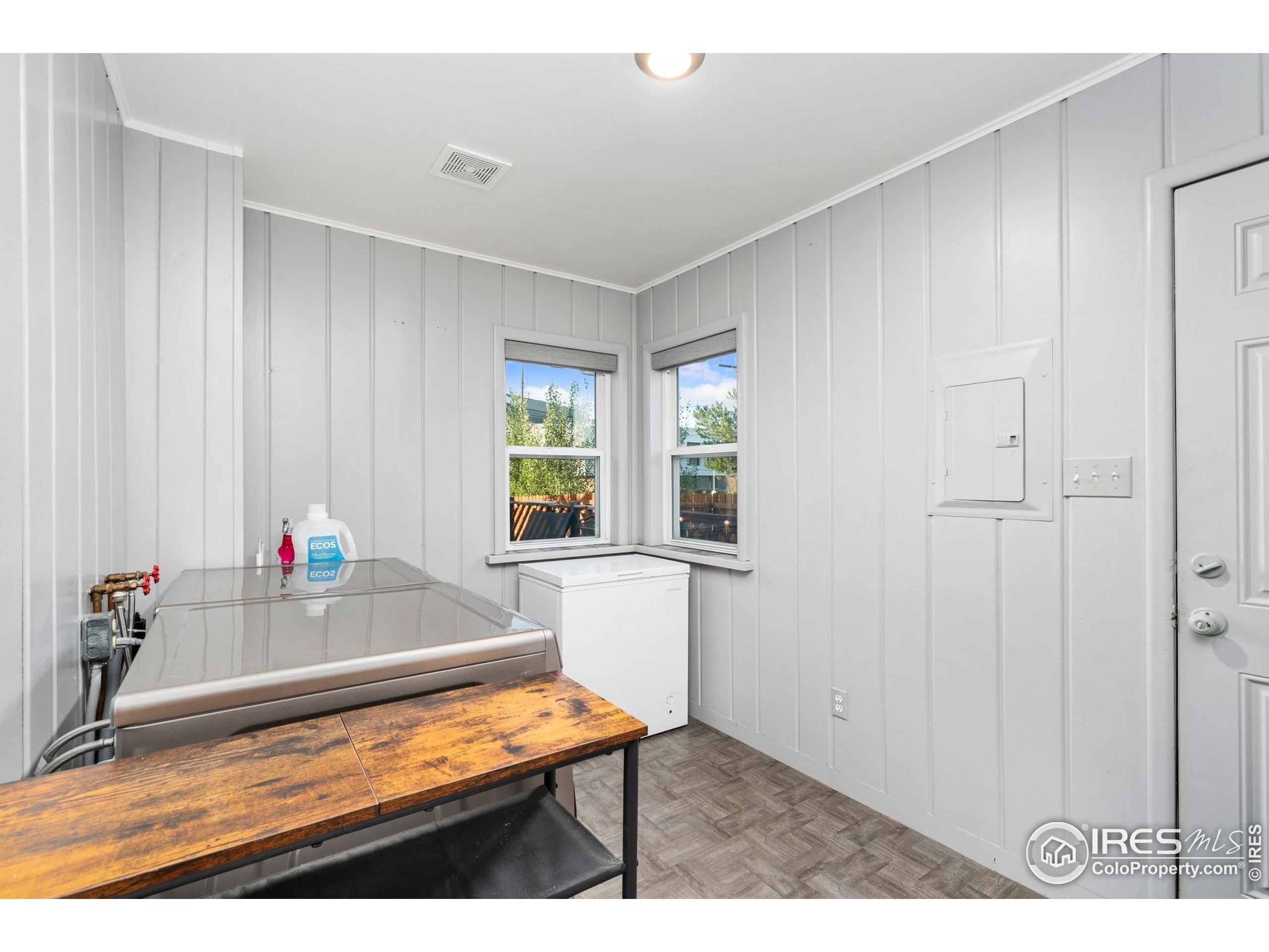 2000 50th Avenue Greeley, CO 80634 - Photo 12 of 34 a living room with furniture and a window