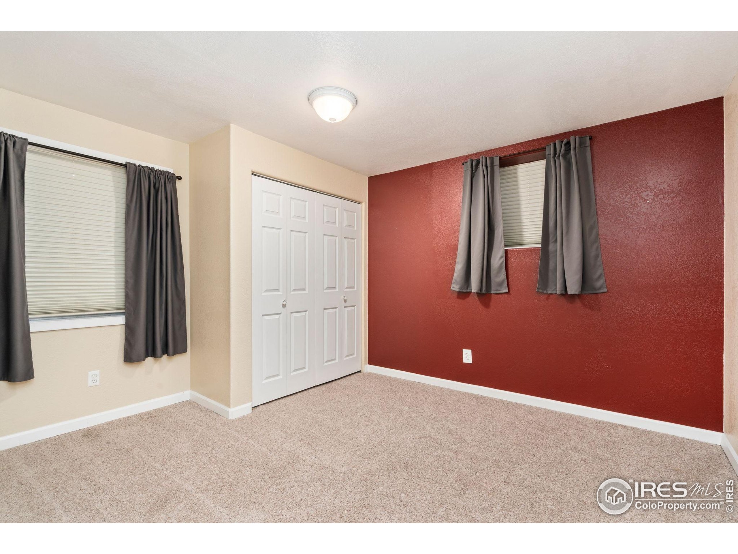 2000 50th Avenue Greeley, CO 80634 - Photo 25 of 34 a view of a livingroom with an empty space and window