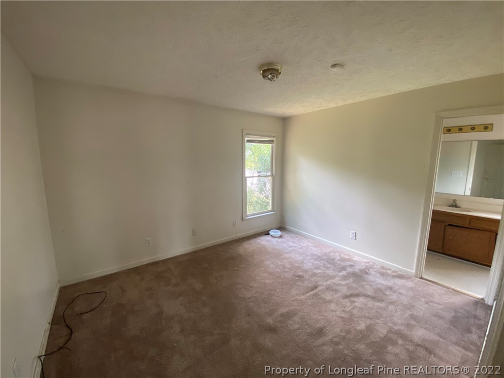 5017 Summer Ridge Road Fayetteville, NC 28303 - Photo 7 of 9 an empty room with a window