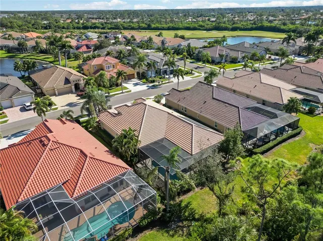 an aerial view of a house with a lake view