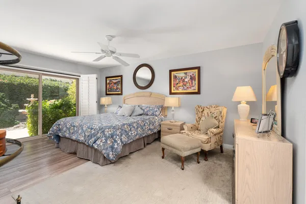 a bedroom with a bed and a couch
