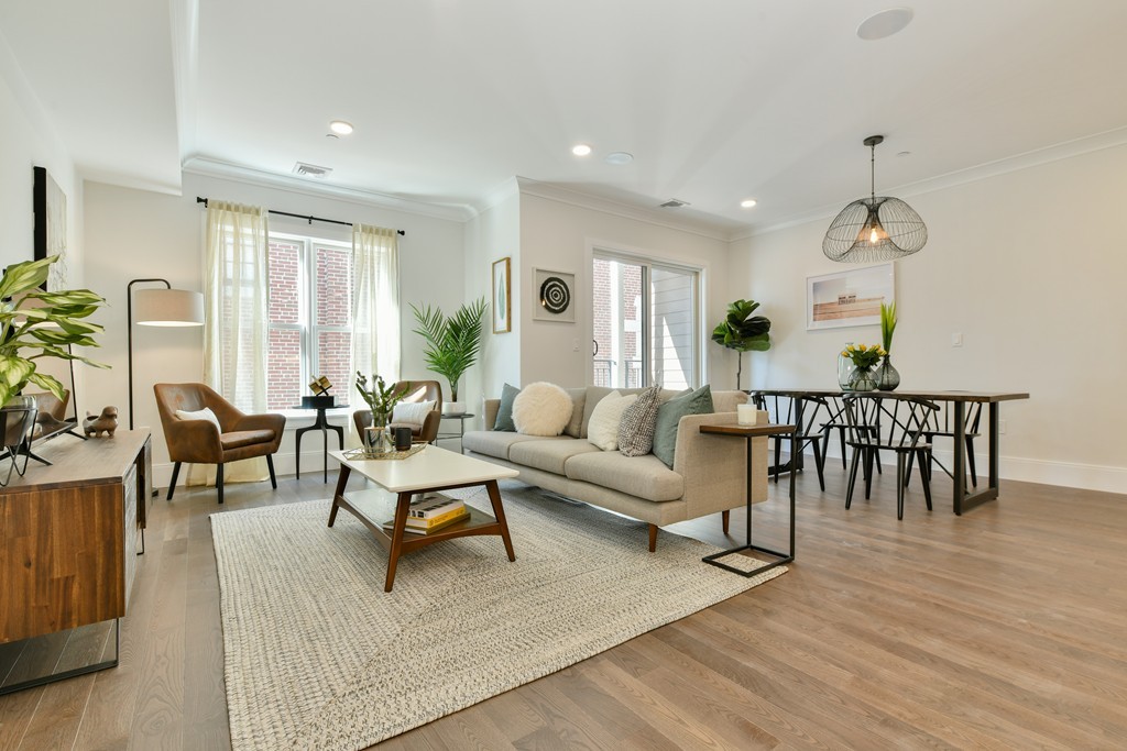 10 Sydney Street, Unit 7 Boston, MA 02125 - Photo 14 of 26 a living room with furniture and a large window