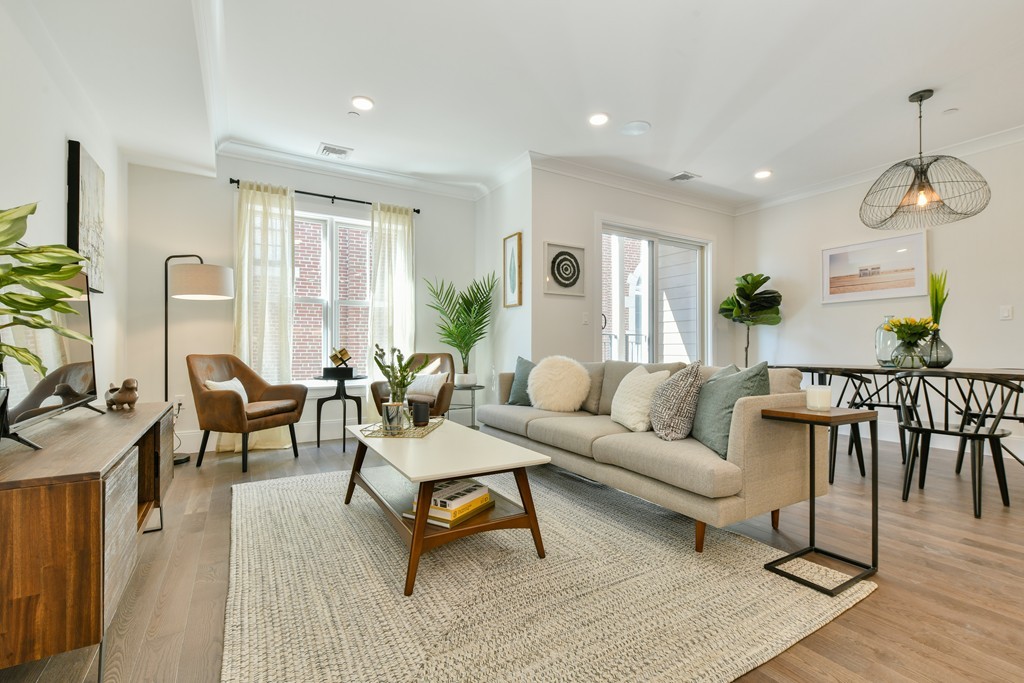 10 Sydney Street, Unit 7 Boston, MA 02125 - Photo 15 of 26 a living room with furniture and a large window