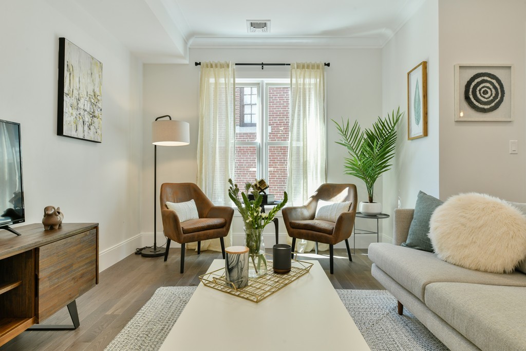 10 Sydney Street, Unit 7 Boston, MA 02125 - Photo 17 of 26 a living room with furniture and a large window