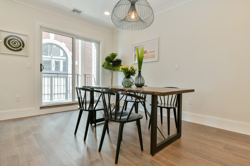 10 Sydney Street, Unit 7 Boston, MA 02125 - Photo 19 of 26 a view of a dining room with furniture window and wooden floor