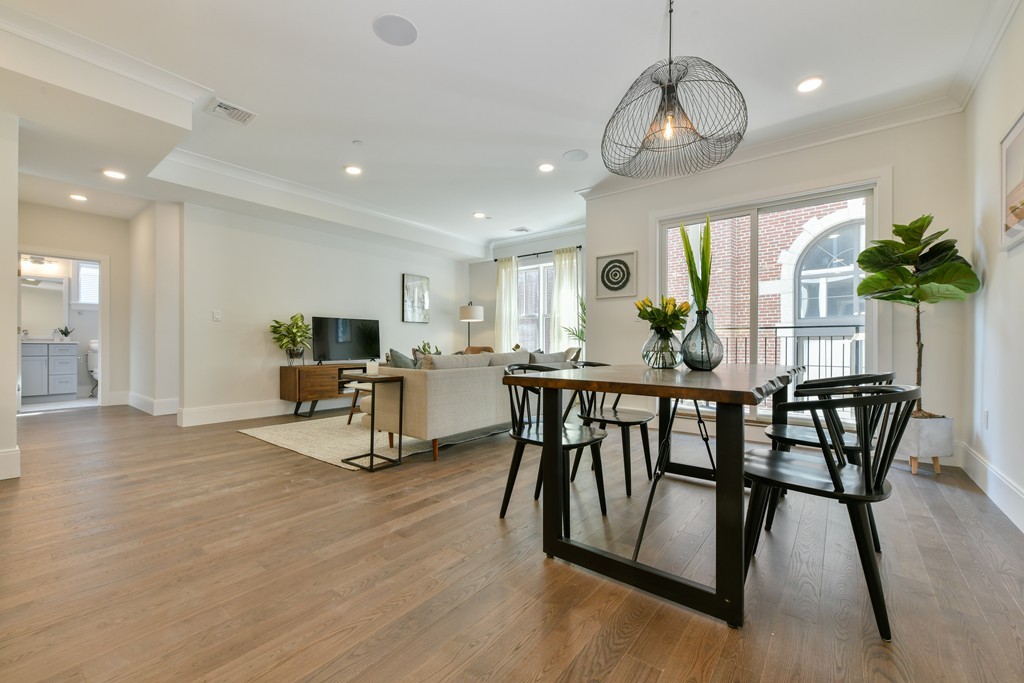 10 Sydney Street, Unit 7 Boston, MA 02125 - Photo 20 of 26 a view of a dining room with furniture window and wooden floor