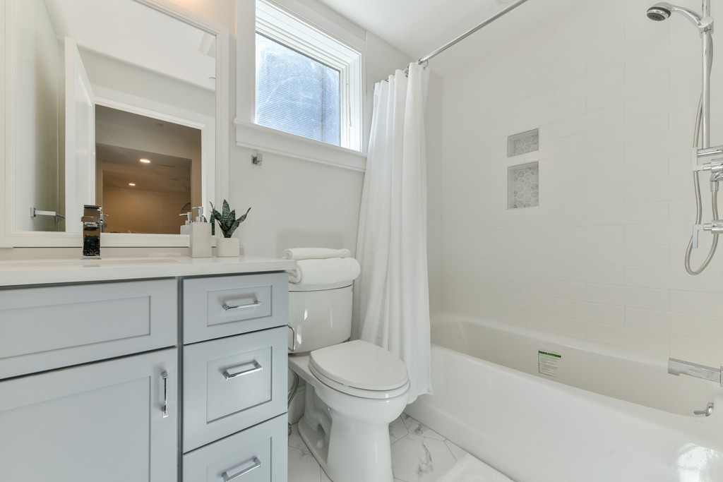 10 Sydney Street, Unit 7 Boston, MA 02125 - Photo 2 of 26 a bathroom with a sink a toilet and shower